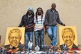 Marshall Gadza (Shakaskraal), Rasta Tafadzo (Amamzimtoti) and Mush Kay (Durban) with their incredible portraits of Nelson Mandela here at the Mr Price Pro Ballito 2013 beach festival.