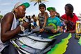 Khule Ngubane (DBN) signing autographs for the groms at the Mr Price Pro Ballito 2013 beach festival.