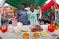 Yatish Harilal (Stanger), Ronaika Harilal (Stanger) and Yurish Harilal (Stanger) showing off their delicious fruit on sale at the Mr Price Pro Ballito Beach Festival 2013