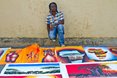 Kim Chakanyuka (Zimbabwe) displaying some of his amazing paintings on sale here at the Mr Price Pro Ballito 2013 beach Festival.