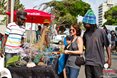 Rasta Thembe (Zimbabwe) Mary Herkert (Finland) and Marshall Gadza (Shakaskraal) negotiate the prices for some of the crafts on sale here at the Mr Price Pro Ballito 2013 beach Festival.